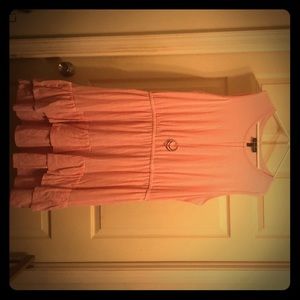 Sleeveless dress pink has ruffles at the bottom